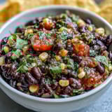 Creamy black bean and sweet corn cowboy caviar dip, bursting with fresh pico de gallo flavor.