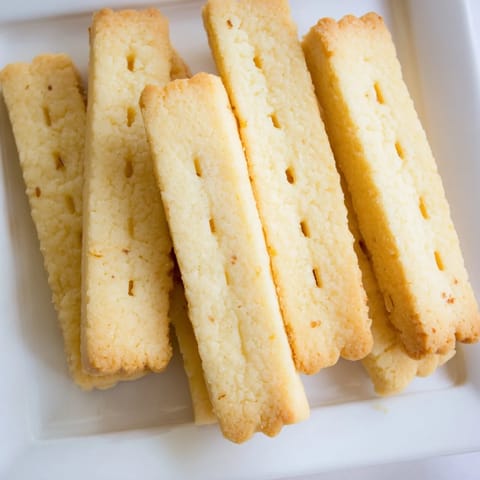 Golden-baked shortbread cookies: buttery, crumbly perfection, ready for sharing and sweet snacking.