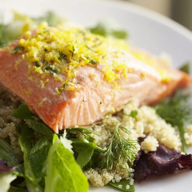 A close-up of the lemon herb salmon salad highlights flaky fish and a zesty citrus vinaigrette.