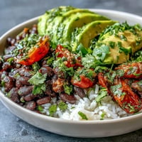 Colorful Plant-Based Taco Bowl with black beans and fresh salsa.